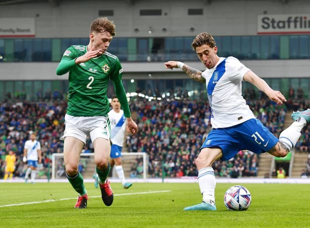 Conor Bradley in action against his Liverpool teammate Kostas Tsimikas when Northern Ireland took on Greece last week