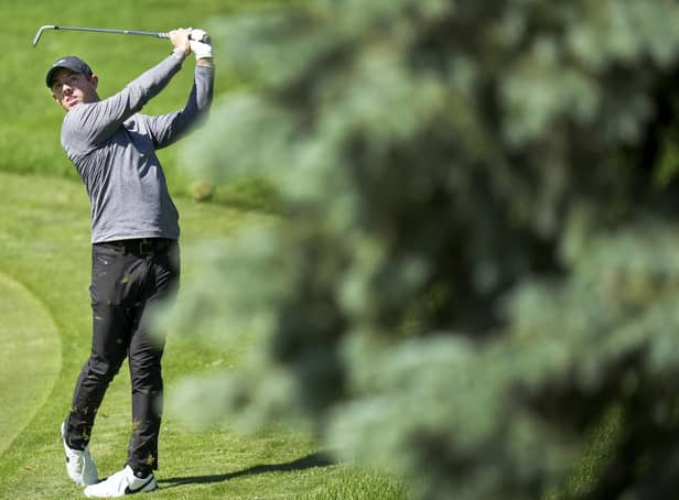 Rory McIlroy hits his approach shot on the 11th hole during the Canadian Open golf pro-am in Toronto. Pic by PA.