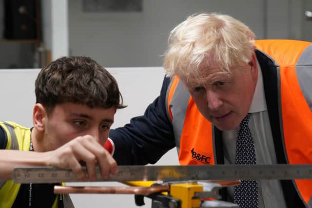 Prime Minister Boris Johnson meeting a student at Blackpool and The Fylde College in Blackpool, Lancashire on Thursday