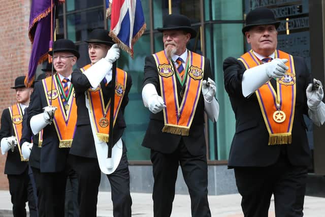 The Belfast County Colour party on parade on the Twelfth