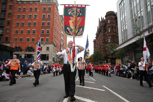 The Twelfth parade in 2016 passes down Bedford Street past the Ulster Hall, near where the BBC took live footage. "The live coverage enables those who are unable to attend to see and feel part of the event on the day," writes John Stewart. Photo by Kelvin Boyes / Press Eye.