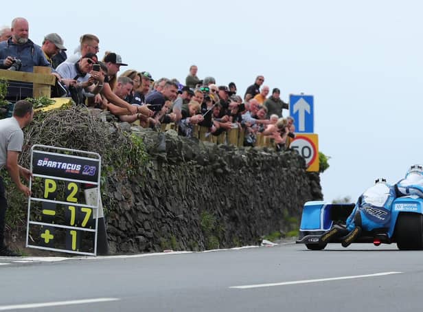 Friday's Sidecar race at the Isle of Man TT has been red-flagged.
