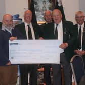 Ivan Grieve, branch secretary, with committee members presenting a cheque to George Clarke, chief executive of the PSNI benevolent fund