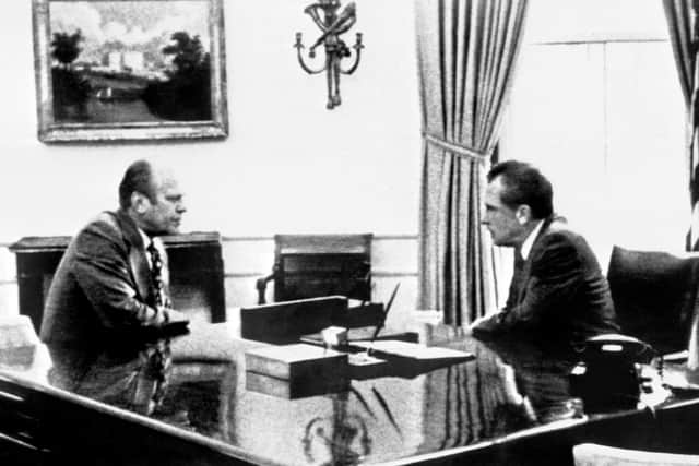 President Richard Nixon talks to Gerald Ford in the Oval Office at the White House in 1974 about the transition of power prior to Nixon’s resignation after the Watergate scandal. (Photo by AFP/Getty Images).
