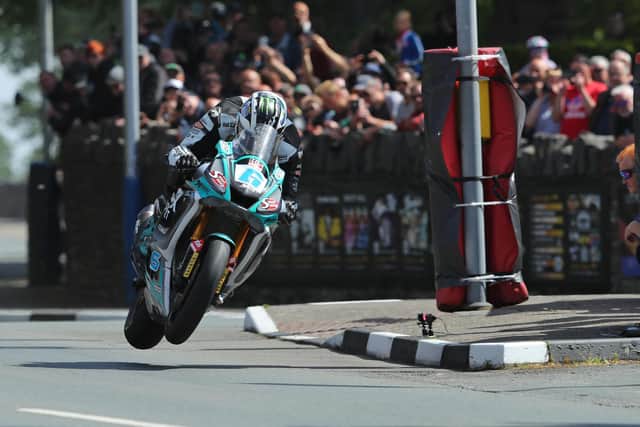 Michael Dunlop won both Supersport races to increase his haul of Isle of Man TT victories to 21.