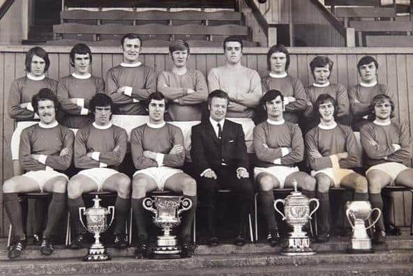 Linfield in 1970-71. Front row (from left) Ronnie McAteer, Bryan Hamilton, Eric Bowyer,  Billy Bingham (manager), Phil Scott, Dessie Cathcart, Billy Sinclair. Back row (from left) Russell Peacock, Alan Fraser, Ivan McAllister,  Derek Humphrey, Bertie McGonigle, Albert Larmour,  Isaac Andrews, Jackie Patterson. Photo: courtesy of Linfield FC
