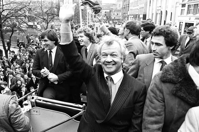Billy Bingham's team are welcomed home by citizens of Belfast as they travelled in an open decked bus through Belfast City centre to City Hall.  Pacemaker Press, 15/11/82