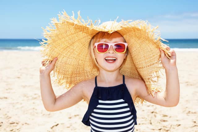 Sunhat, sunglasses and sun cream - a vital part of summer kit for your child