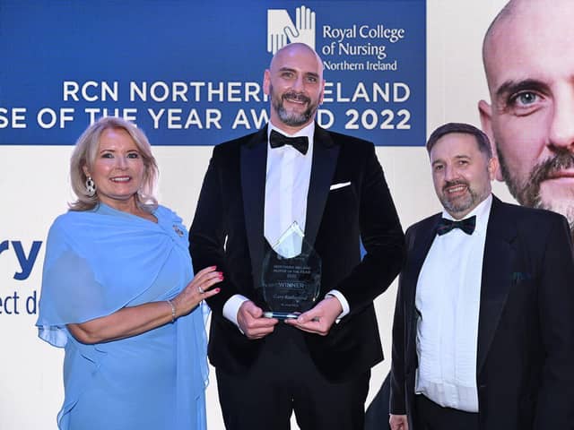 Royal College of Nursing general secretary Pat Cullen, nurse of the year Gary Rutherford, and Health Minister Robin Swann