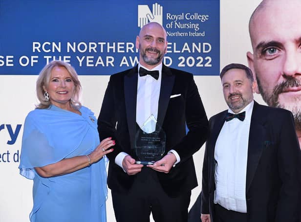 Royal College of Nursing general secretary Pat Cullen, nurse of the year Gary Rutherford, and Health Minister Robin Swann