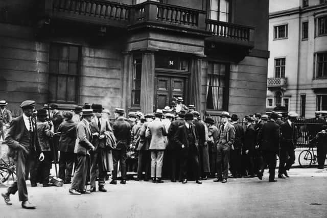 Crowds are pictured outside the London home of Sir Henry Wilson after he was shot dead on June 22, 1922
