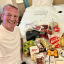 Jonathan Guest pictured in The Covid Quarantine Hotel in Tokyo with some of his food supplies that had been delivered