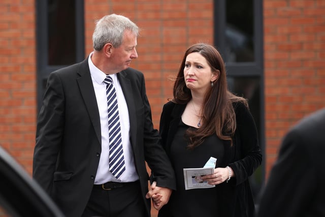Permanent Secretary of the Department of Justice, Northern Ireland Richard Pengelly and Emma Little-Pengelly leave Good Shepherd Church in Belfast following a Requiem Mass for Aideen Kennedy.