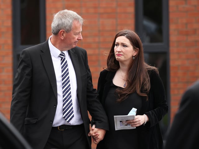 Permanent Secretary of the Department of Justice, Northern Ireland Richard Pengelly and Emma Little-Pengelly leave Good Shepherd Church in Belfast following a Requiem Mass for Aideen Kennedy.