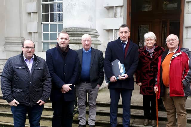 Campaigners for a Police Ombudsman investigation into a UVF gun attack on the Thierafurth Inn Pub in Kilcoo, Co Down in 1992 were at the High Court today.

Included at South Down MP Chris Hazzard (second left) and solicitor Gavin Booth (third right).