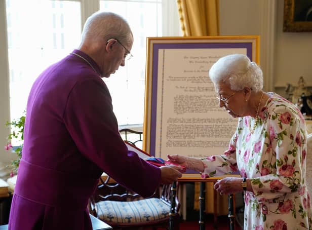 Queen Elizabeth II receives the Archbishop of Canterbury Justin Welby at Windsor Castle, where he presented her with a special 'Canterbury Cross' for her 'unstinting' service to the Church of England over seventy years and a citation for the Cross, which was presented as a framed piece of calligraphy. Picture: Andrew Matthews/PA Wire