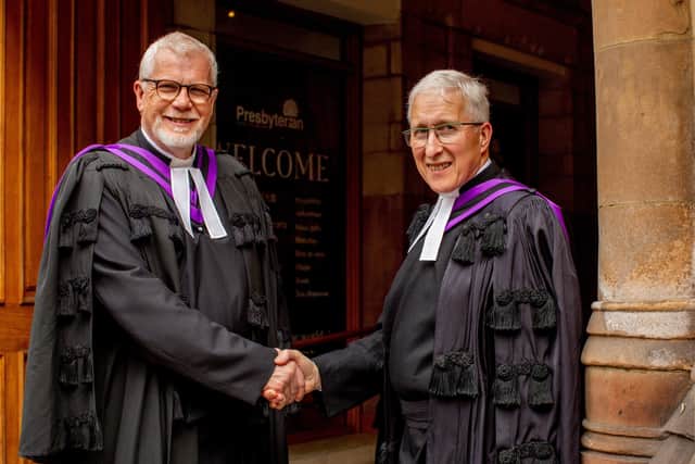 The outgoing Moderator of the Presbyterian Church in Ireland (left) Very Rev Dr David Bruce, shakes hands with his successor and Moderator of the all-Ireland denomination for 2022-2023, Right Reverend Dr John Kirkpatrick.