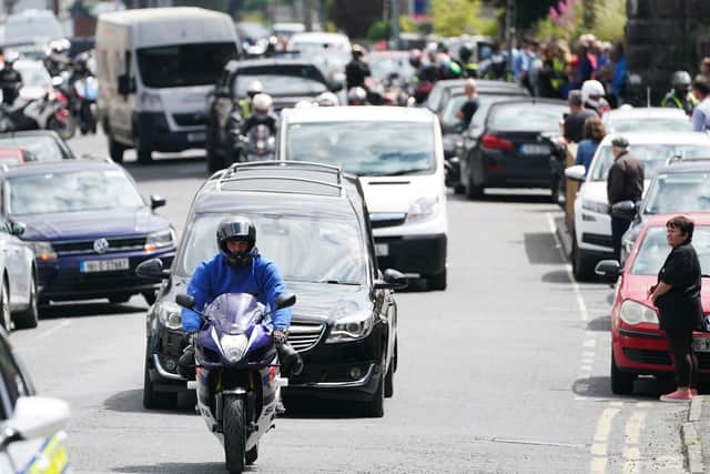 The hearse carrying the remains of Northern Irish rider Jack Oliver, along with a motorcycle escort, leaving Navan, Co. Meath for his return home to Limavady in Northern Ireland