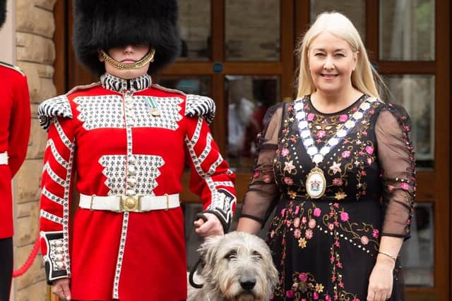 Mayor of Ards and North Down, Karen Douglas, right, with a soldier from the Irish Guards and the regimental mascot, Turlough Mór, known to the soldiers as Seamus. The regiment is in town to be awarded the Freedom of the Borough.