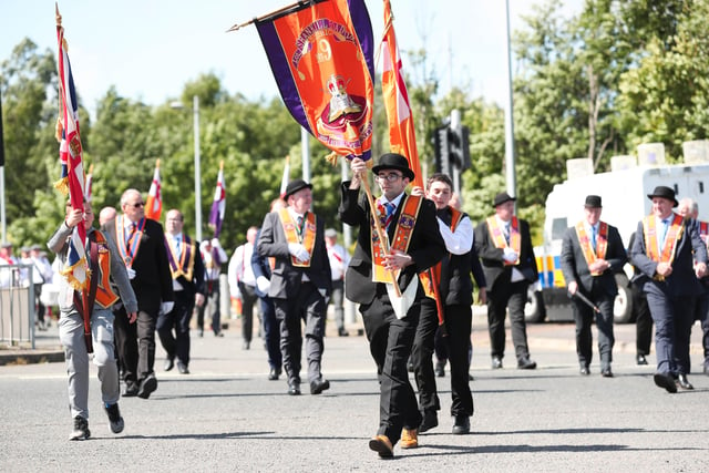 Members of the Orange Order and marching bands pictured walking onto the Springfield Road in Belfast as they take part in the annual Whiterock Parade in west Belfast this afternoon.


Photo by Kelvin Boyes / Press Eye.