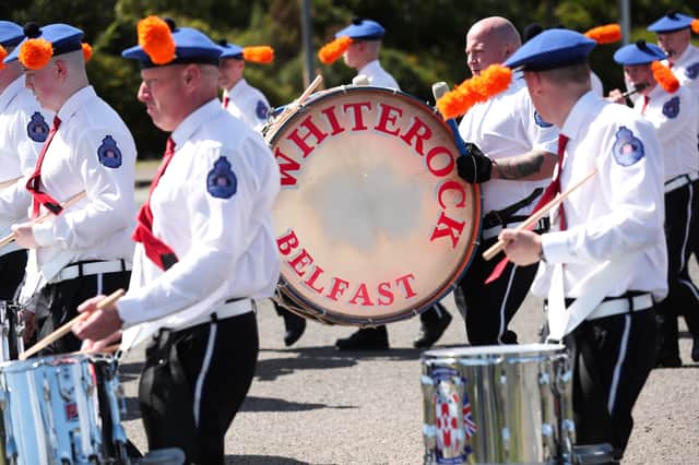 Members of the Orange Order and marching bands pictured walking onto the Springfield Road in Belfast as they take part in the annual 'Whiterock Parade' in west Belfast this afternoon.Photo by Kelvin Boyes / Press Eye.