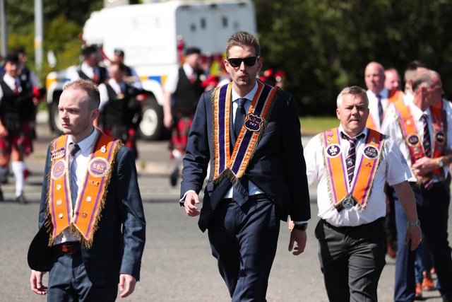 Phillip Brett MLA with members of the Orange Order and marching bands pictured walking onto the Springfield Road in Belfast as they take part in the annual 'Whiterock Parade' in west Belfast this afternoon.


Photo by Kelvin Boyes / Press Eye.