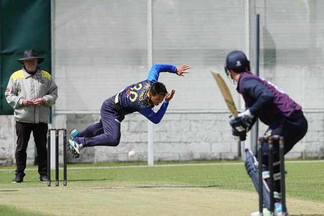 Woodvale's Ruhan Pretorius puts everything into this delivery during the Robinson Services Premier League game at Ballygomartin Road, Belfast.  Photo by David Maginnis/Pacemaker Press