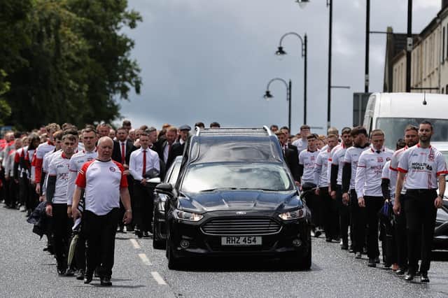 The cortege as it arrives at St Patrick's Church, Dungannon, County Tyrone, for the funeral for GAA star Damian Casey