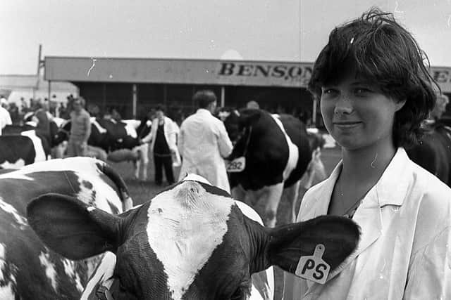 Twenty-year-old Libby Sufferin from Crumlin with her father and uncle’s first prize winning heifer Ballyclan Snowgem at the Ballymena Show in June 1982. Picture: Farming Life/News Letter archives