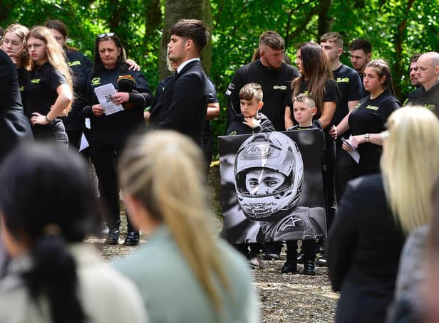 Crowds line the scene for the funeral of Jack Oliver