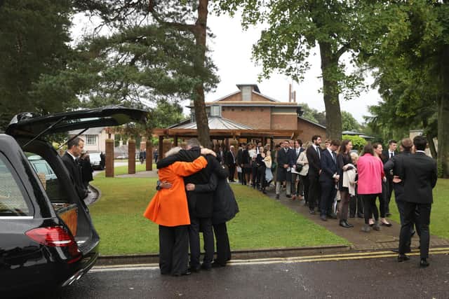 Mourners leaving the funeral of long-time owner of the Irish News newspaper, James Fitzpatrick at St Brigid's Parish Church, Belfast.