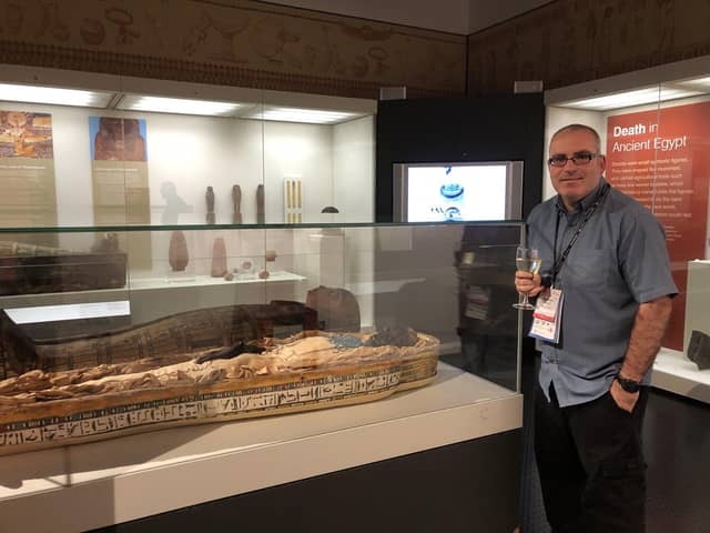 Dr Ken Griffin in the Ulster Museum alongside the mummy Takabuti, the exhibit that triggered his interest in Egyptology