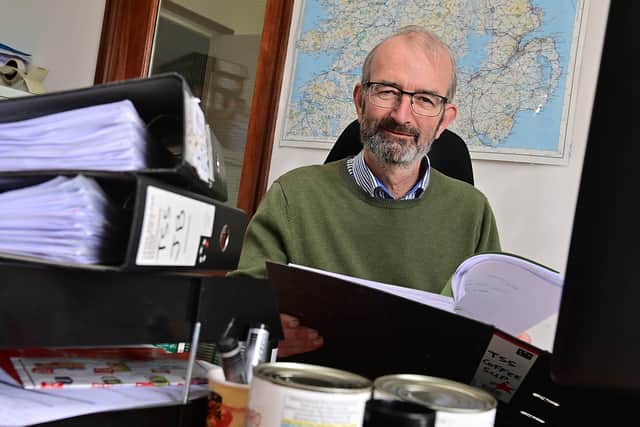 Dermot Johnson, Managing Director of Johnson Bros wholesalers in Lisburn surrounded by some of the paperwork he is required to do by the NI Protocol. Picture By: Arthur Allison/Pacemaker Press.