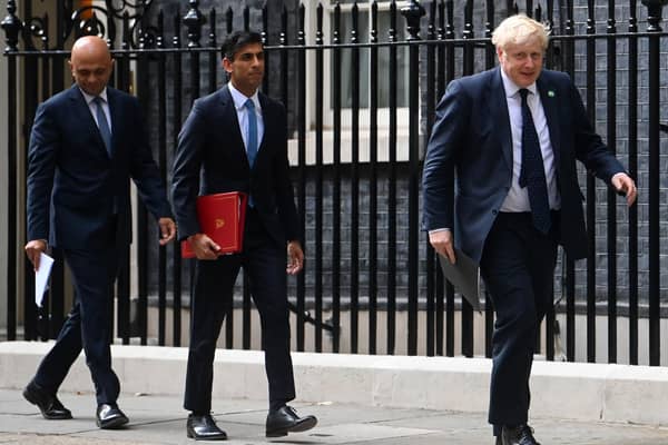 Health Secretary Sajid Javid, Chancellor of the Exchequer Rishi Sunak and Prime Minister Boris Johnson arriving at No 9 Downing Street for a media briefing last year. Sunak and Javid, have resigned after the Prime Minister was forced into a humiliating apology over his handling of the Chris Pincher row. 