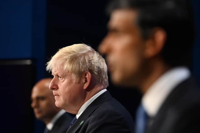 Ex-Health Secretary Sajid Javid, Prime Minister Boris Johnson and Ex-Chancellor of the Exchequer Rishi Sunak, during a media briefing in Downing Street last year. Sunak and Javid have resigned after the Prime Minister was forced into a humiliating apology over his handling of the Chris Pincher row. Photo: Toby Melville/PA Wire