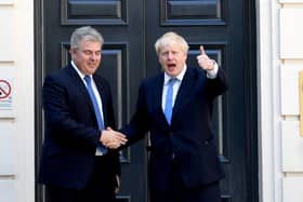The then Conservative party chairman Brandon Lewis with Boris Johnson after it was announced that the latter had won the leadership ballot for the Tories. Mr Lewis, now NI secretary, is said to believe Mr Johnson's position is untentable. Photo: Stefan Rousseau/PA Wire