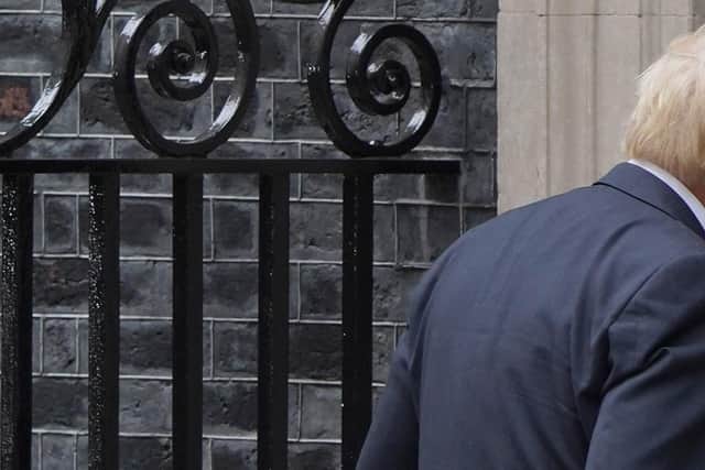 Prime Minister Boris Johnson walks into 10 Downing Street, London, after reading a statement formally resigning as Conservative Party leader after ministers and MPs made clear his position was untenable. He will remain as Prime Minister until a successor is in place. Picture date: Thursday July 7, 2022.