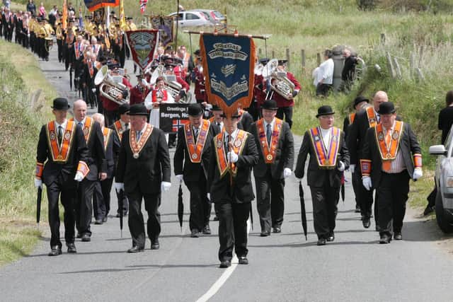 Members of the Donegal Grand Orange Lodge lead the parade  in Rosnowlagh