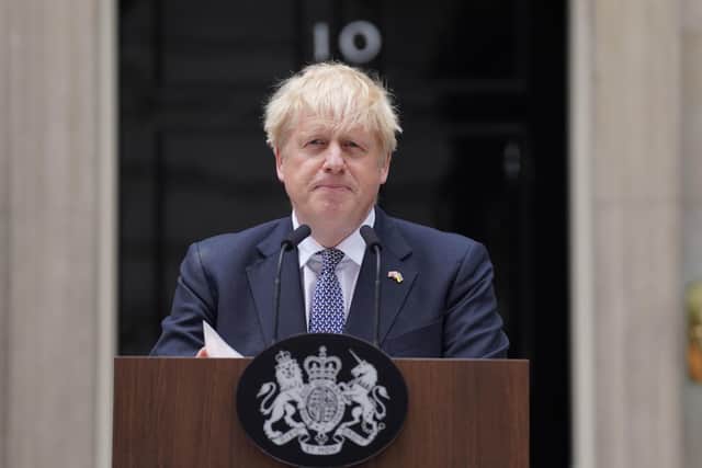 Prime Minister Boris Johnson reads a statement outside 10 Downing Street formally resigning as Conservative Party leader