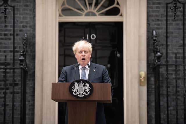 Prime Minister Boris Johnson reads a statement outside 10 Downing Street, London, formally resigning as Conservative Party leader after ministers and MPs made clear his position was untenable. Photo: Stefan Rousseau/PA