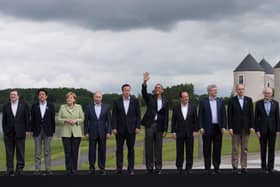 The then president of the European Commission, Jose Manuel Barroso (left) on June 18 2013 is joined at the G8 Summit on Lough Erne in Enniskillen, by (from left to right), the then Japanese Prime Minister Shinzo Abe, German Chancellor Angela Merkel, Russian President Vladimir Putin, Prime Minister David Cameron, US President Barack Obama, French President Francois Hollande, Canadian Prime Minister Stephen Harper, Italian Prime Minister Enrico Letta and EU President Herman van Rompuy. Photo: Stefan Rousseau/PA Wire