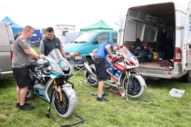Michael Dunlop in the paddock at Walderstown with his Yamaha Supersport machine and Buildbase Suzuki Superbike.