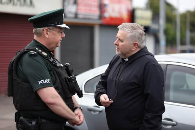 Police Service of Northern Ireland Chief Constable Simon Byrne speaking with Father Gary Donegan while on a walkabout in Ardoyne, Belfast, ahead of a  Twelfth of July parade.