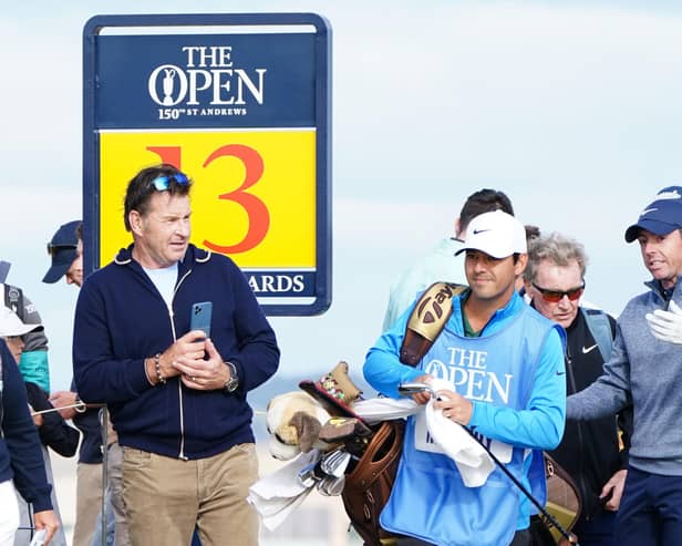Northern Ireland's Rory McIlroy (right) with Nick Faldo (left) on the 13th during practice day four of The Open at the Old Course, St Andrews. Pic by PA.