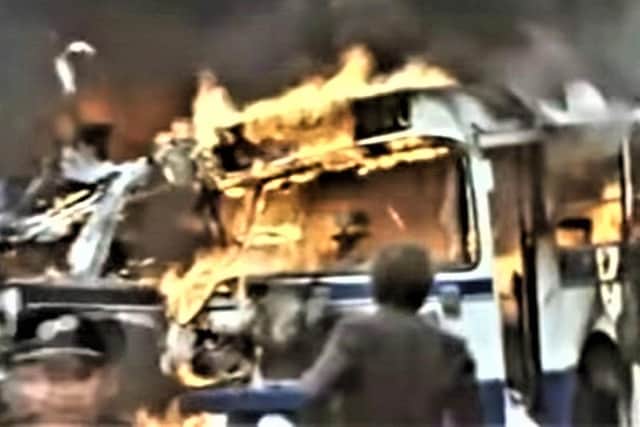 In these images taken from BBC news footage, buses are ablaze following the wave of explosions