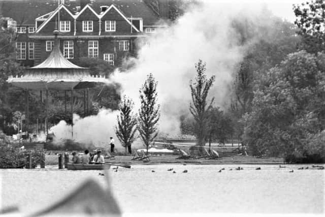 Smoke rises from the bandstand where the IRA detonated a bomb hidden underneath a group of army musicians