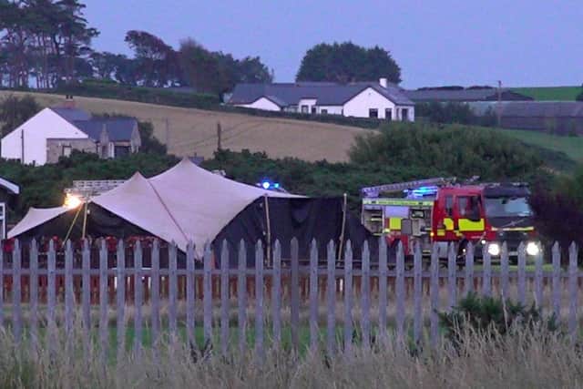 Police and emergency services attending Newtownards Airport in County Down, following a crash involving an aircraft