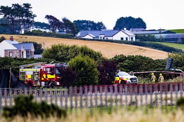 PACEMAKER BELFAST  19/07/2022
Emergency services including the Northern Ireland Fire and Rescue Service at the scene of the light aircraft crash in Newtownards airfield on Tuesday evening.