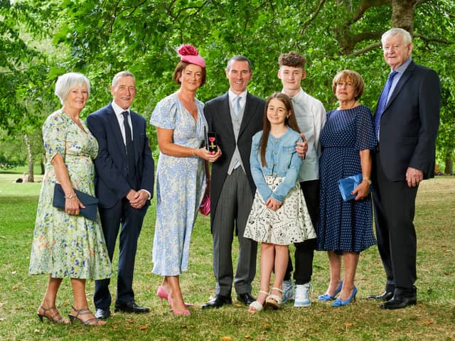 Ray Hutchinson, Managing Director of Gilbert-Ash receives an OBE at Bucking hame Palace London. He is pictured with his family. Photo credit: Simon Jacobs