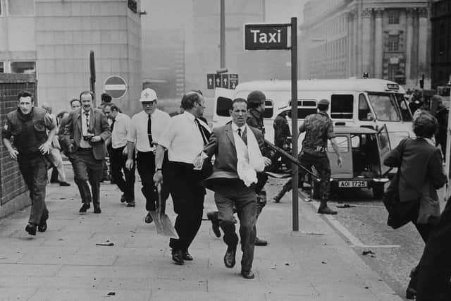 Panic at Oxford Street bus station on Bloody Friday, 21 July 1972.
 Photographer Eddie Harvey is pictured clutching a camera as he runs following a second bomb alert.